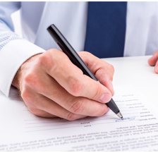 person signing with pen